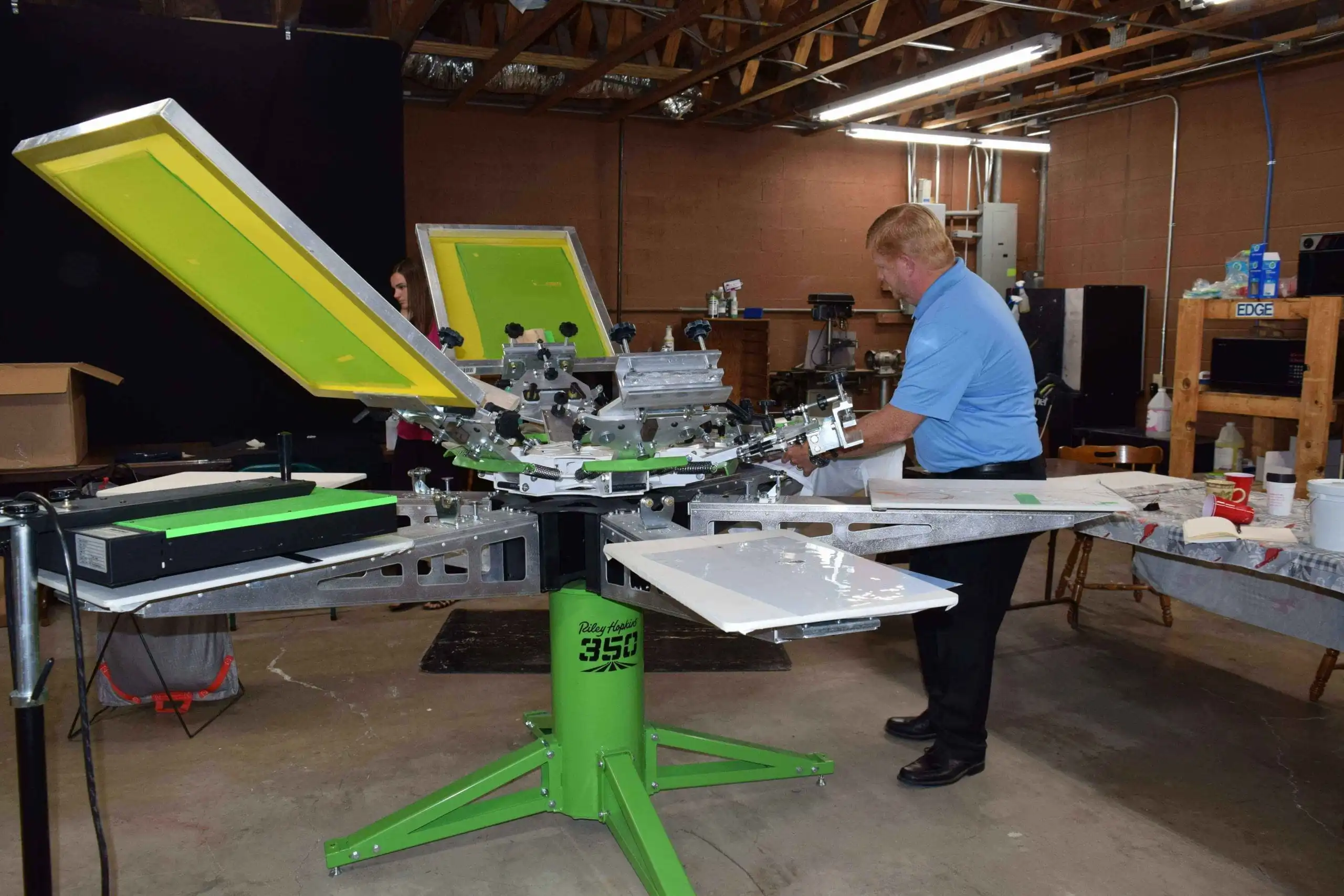 Screen Printing Dubai service showing professional screen printing equipment and apparel printing production process